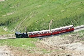 panoramic view of the locomotive on the railway in the brienz rothornbahn mountains