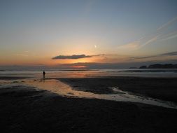man on the coast at dusk