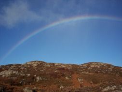 landscape of splendiferous rainbow over countryside