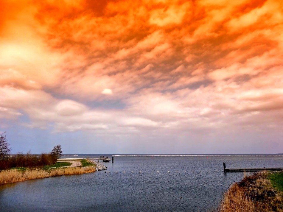 orange sunset over the coastline in the Netherlands