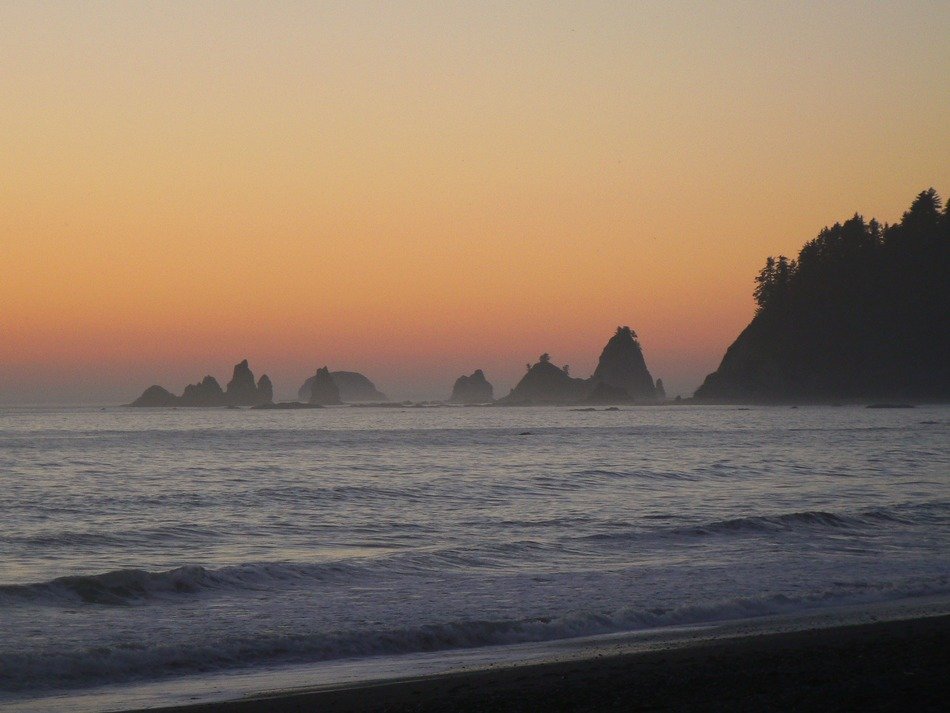 sunset in the haze over the ocean coast