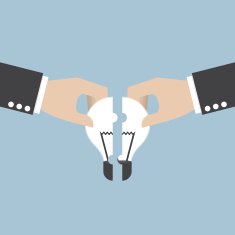 Businessman hands assembling pieces of light bulb jigsaw puzzle