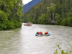 canoe with people on the river