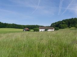 barn in a green field in picturesque Germany