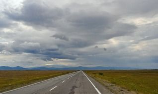 overcast sky over asphalt road