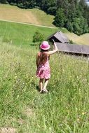 girl in a pink dress and hat