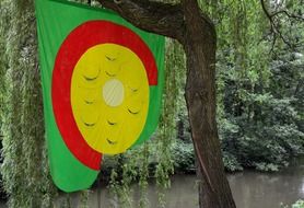 colorful flag on a tree in the forest