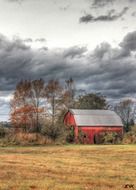 red barn in the autumn field