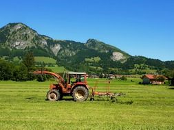 Rural landscape of a tractor on the field