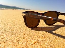 sunglasses on the beach sun