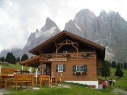 restaurant in mountain hut in front of foggy dolomites, italy, south tyrol