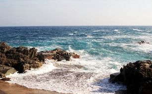 calm mediterranean sea at rocky coast, spain, catalonia, costa brava