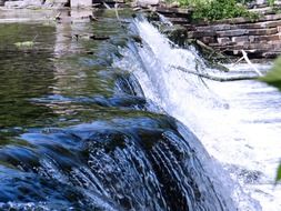 panoramic view of a waterfall on a sunny day