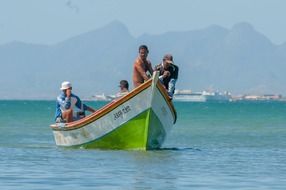 people on a boat in a picturesque landscape