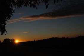 bright sunset sun in the black sky