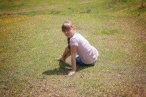 girl sitting on the meadow