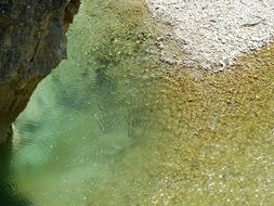 Calm water flow near the mountain