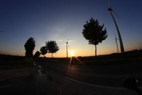 windmills at sunset