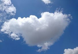 closeup photo of white soft fluffy clouds in the blue sky