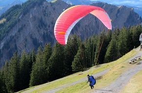 paragliding over the green mountain