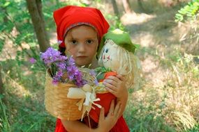 girl in the costume of the red little riding hood