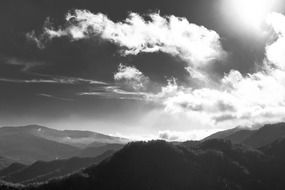 black white photo cloud over the mountains