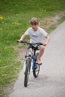 child girl riding a bicycle