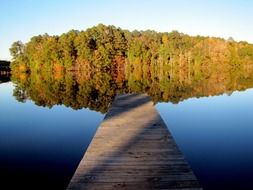 wooden pier on the silent lake