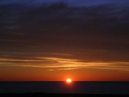 Bright sun in the horizon at sunset