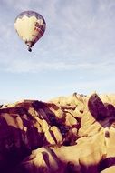 hot air balloon over dunes