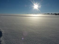 intact snow cover in the bright sun