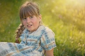 child girl blond portrait in the meadow