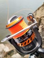 Fishing rod on the background of the lake close-up