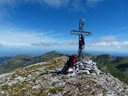 summit cross on cima della saline mountain at sky, italy