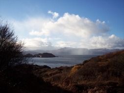 sea sky and clouds rocky landscape