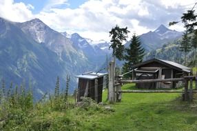 wooden hat on meadow at scenic mountains, austria, maiskogel, kaprun