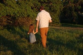 dad and daughter outdoors at dusk