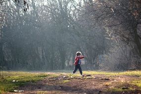 child among nature on a sunny day