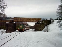 train under the metal bridge in Poland