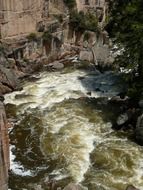 carrying water of the river near the rock