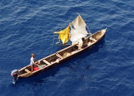 gulf of guinea with fishermen boat floating on a sunny day