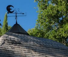 wind direction indicator on a wooden roof