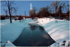 river among the banks in the snow in winter