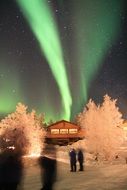 northern lights, cottage, people