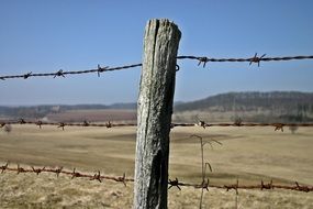 barbed wire fence around the pasture