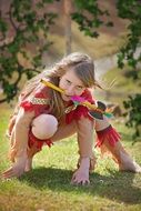 girl in the costume of indians in the garden