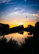 beautiful orange sunset reflected in the lake