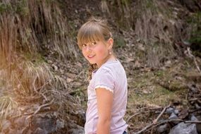 photo of girl with long hair on nature