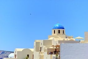 blue church dome on the blue sky in santorini