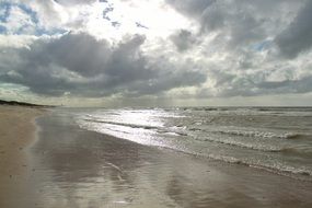 sandy coast under the clouds near the sea